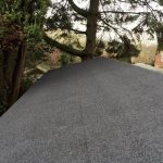 top of a grey bitumen garden shed roof
